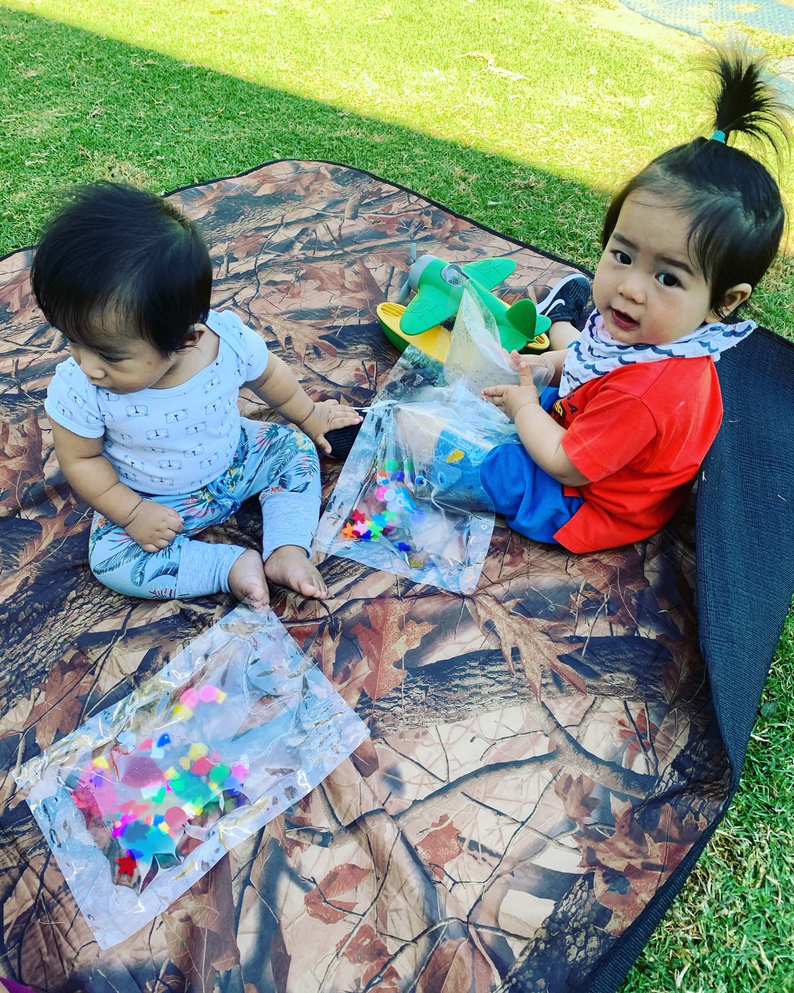 Babysitter playing with children at home